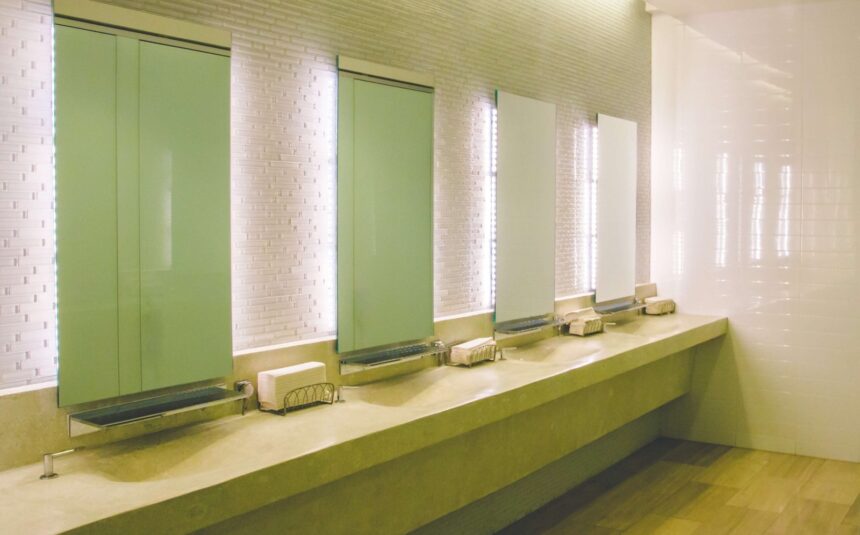 Clean commercial restroom with sinks and mirrors
