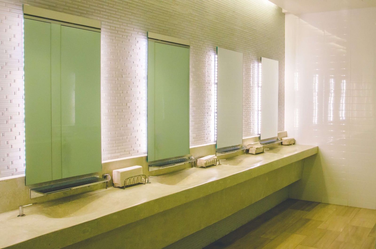 Clean commercial restroom with sinks and mirrors